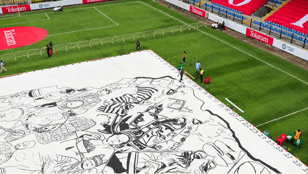 Wide aerial of the drawing across the soccer pitch