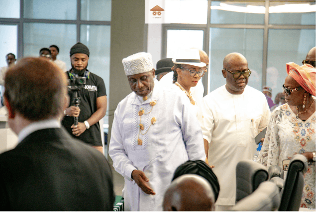Guest in traditional attire amid the remembrance gathering