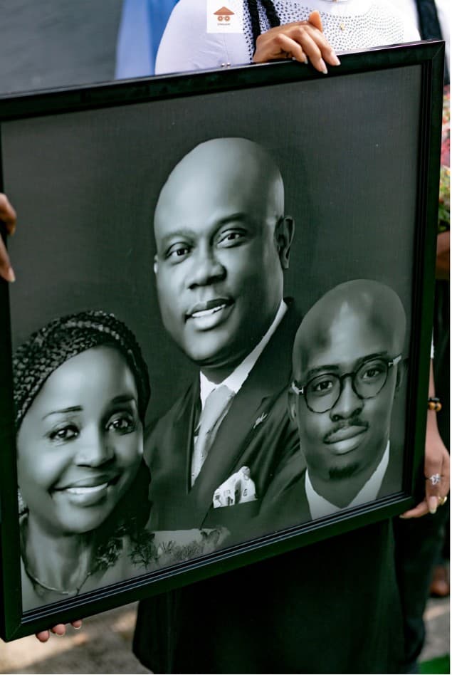 Framed family portrait held in tribute