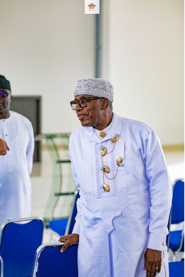 Elderly guest in traditional attire at the memorial