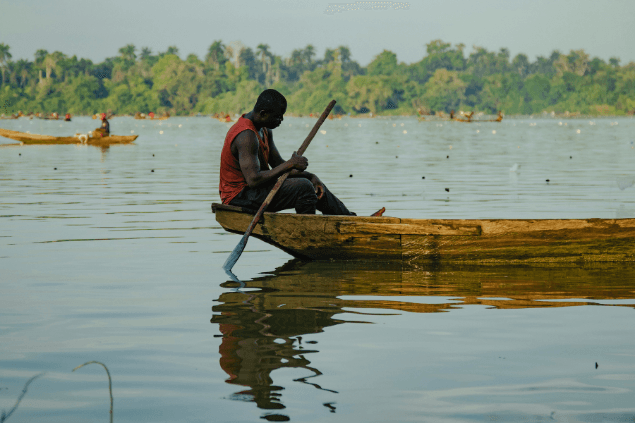 Documentary photography of a fisherman on a river